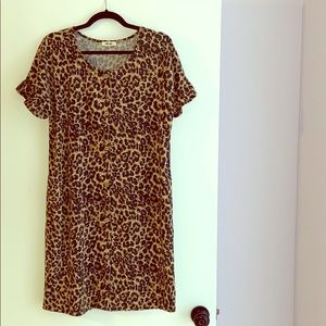 Animal print knee length dress with pockets.